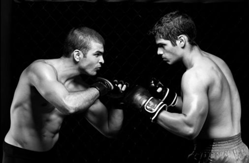 black and white photo of two men facing off in a boxing match